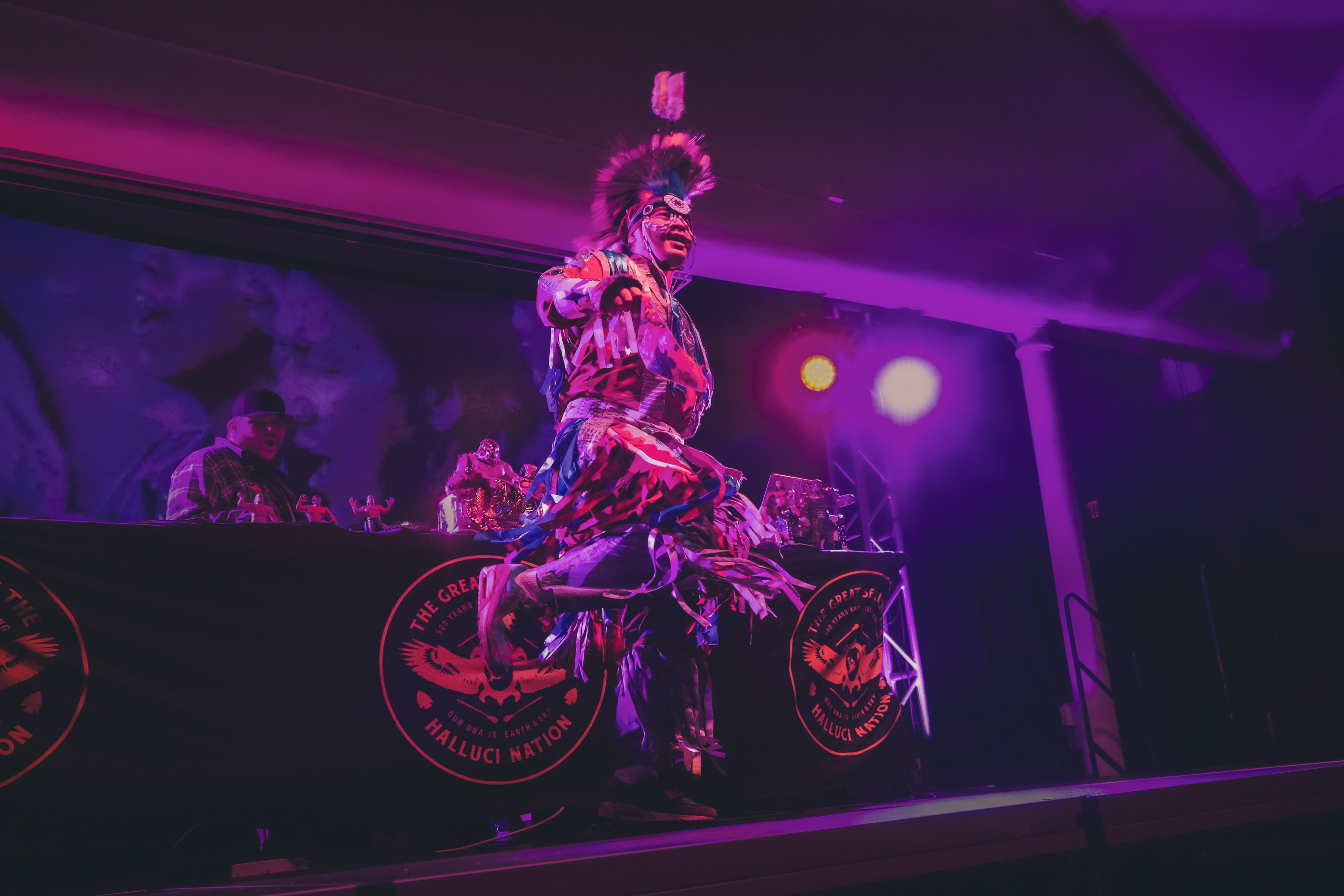Indigenous dancer performing at Collis