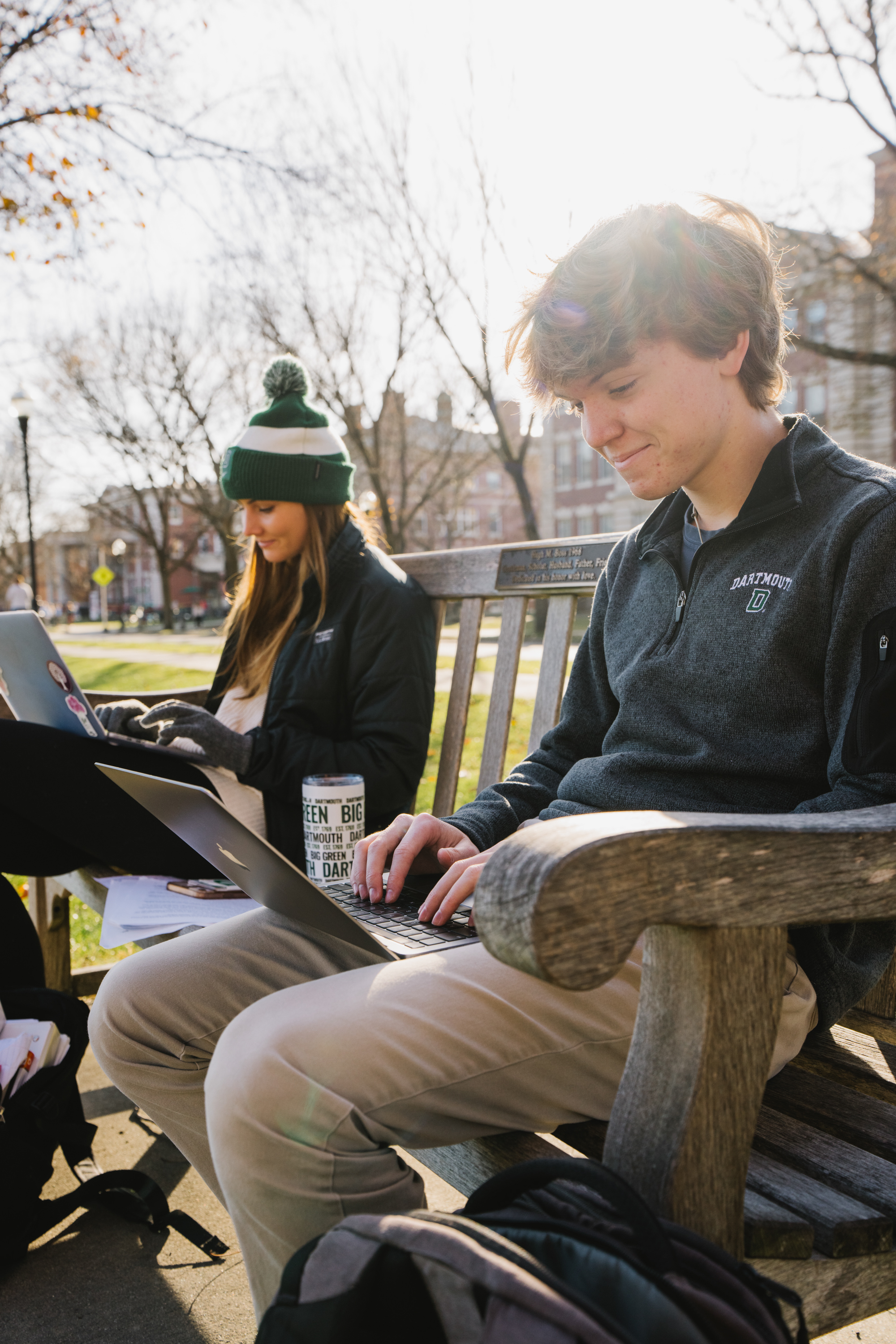 Sadie Jackson and Charles White on a bench on the Green