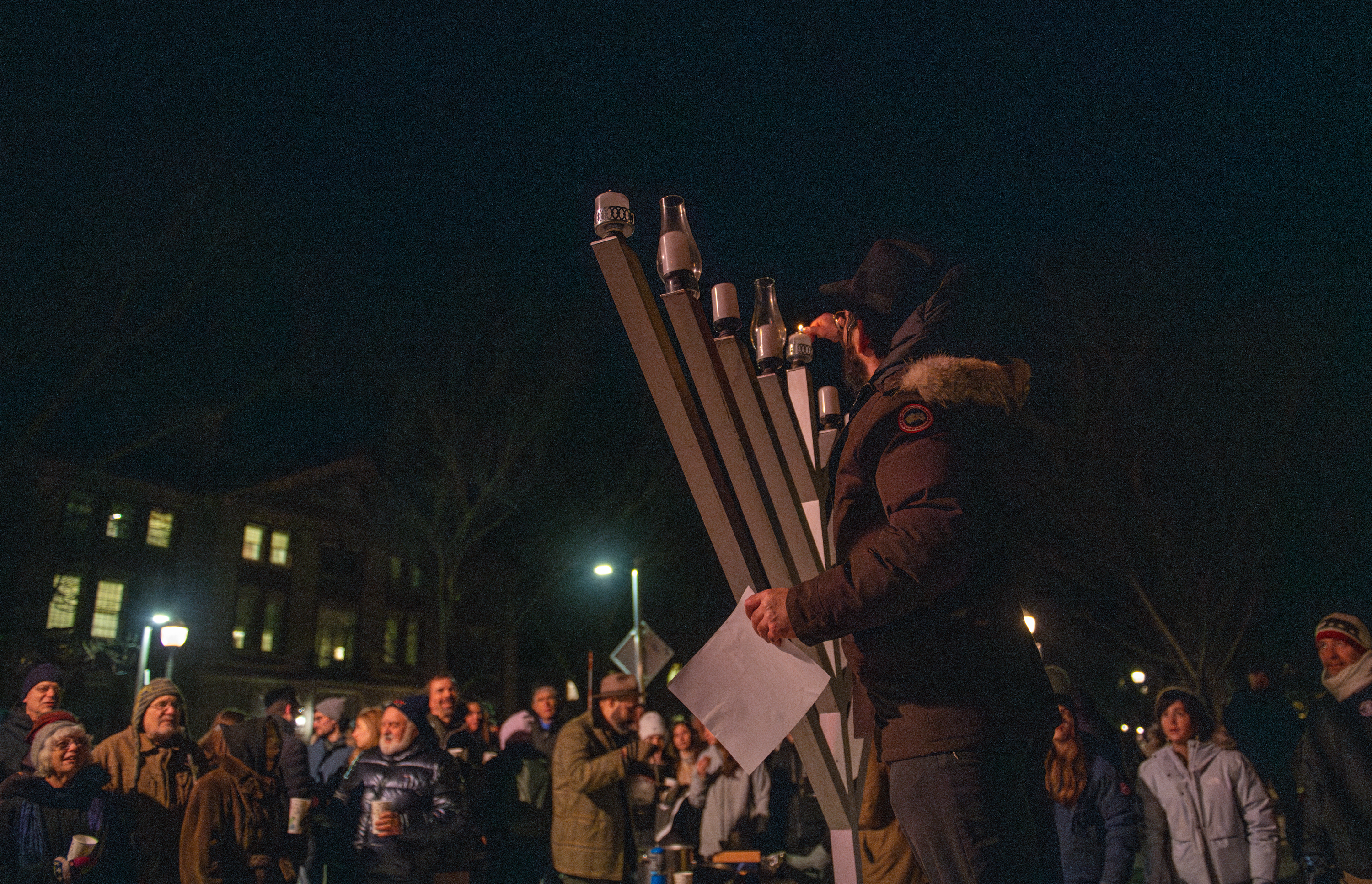 Moshe Gray lights the Dartmouth Menorah