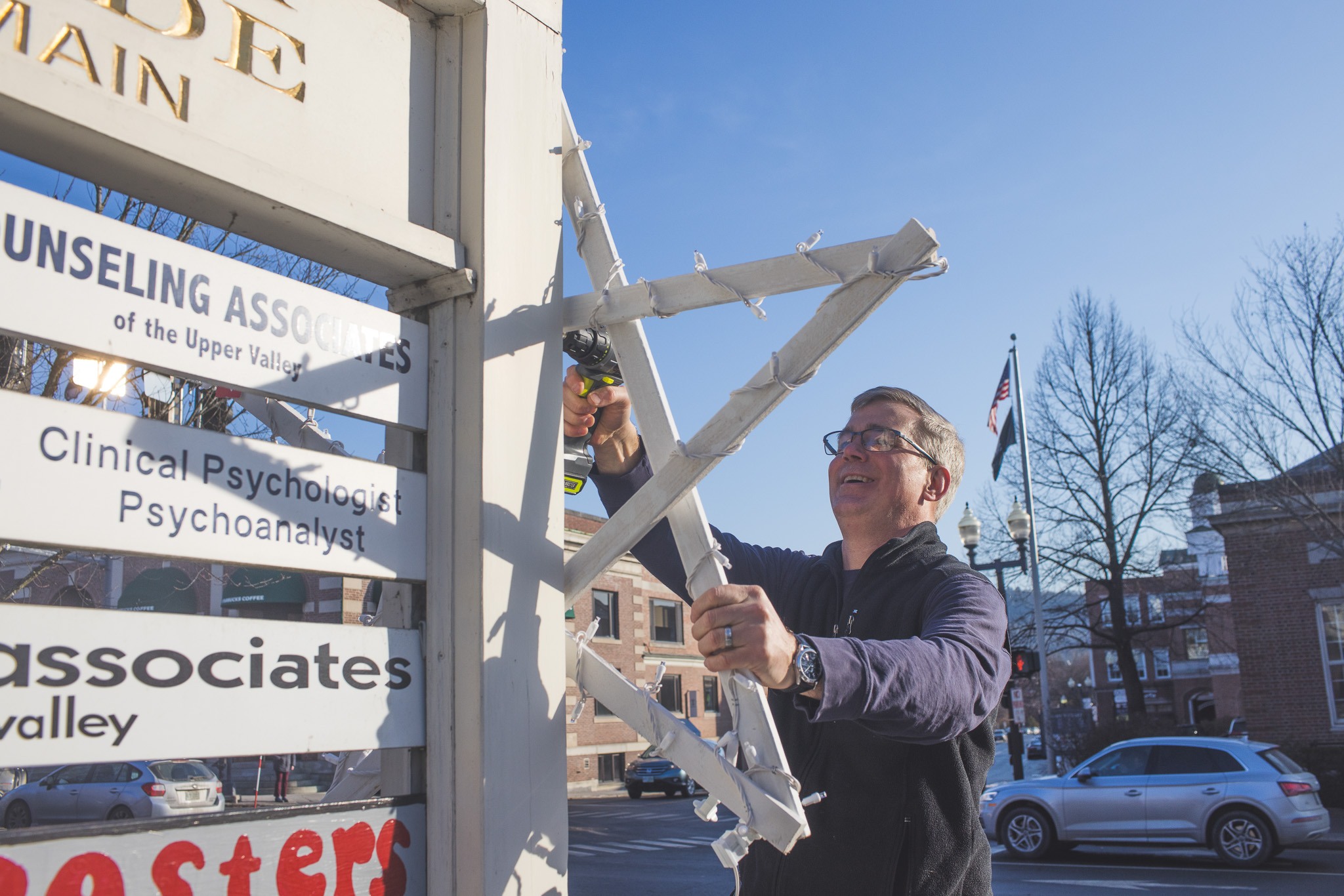 Clem Powers attaches a lighted star to the Nugget Arcade sign