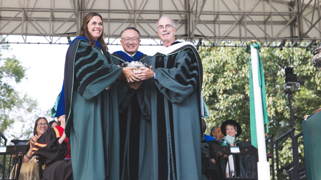 Sian Beilock, Jim Kim, and Philip Hanlon hold the Wentworth Bowl