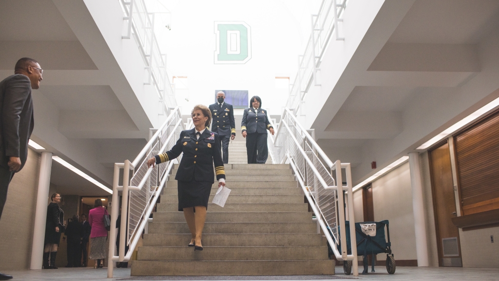 Antonia Coello Novello, Jerome Adams, and Regina Benjamin walking down stairs at Dartmouth