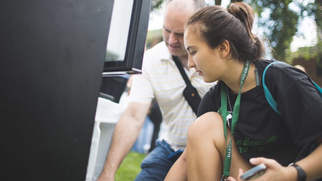 Dartmouth student looks at mini refrigerators
