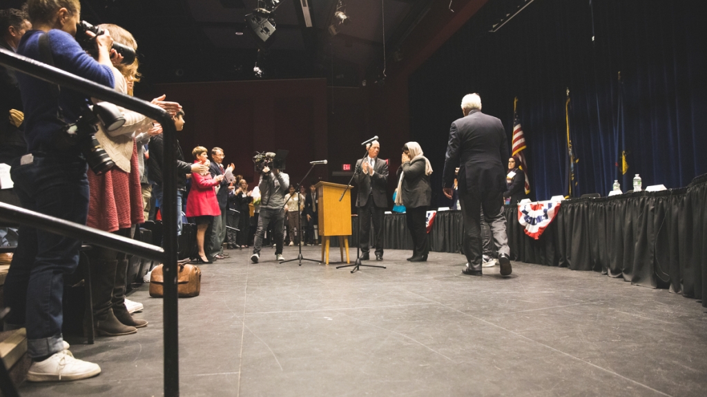 People on stage at high school ceremony