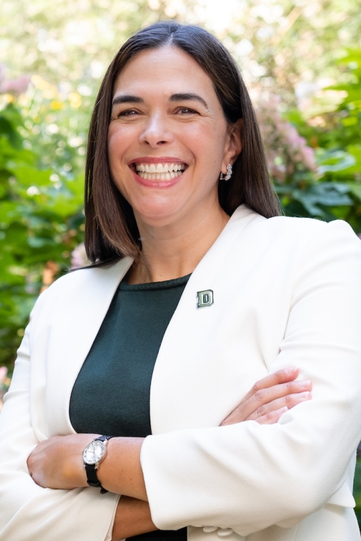 portrait photo of a smiling Sian Leah Beilock wearing a D lapel pin